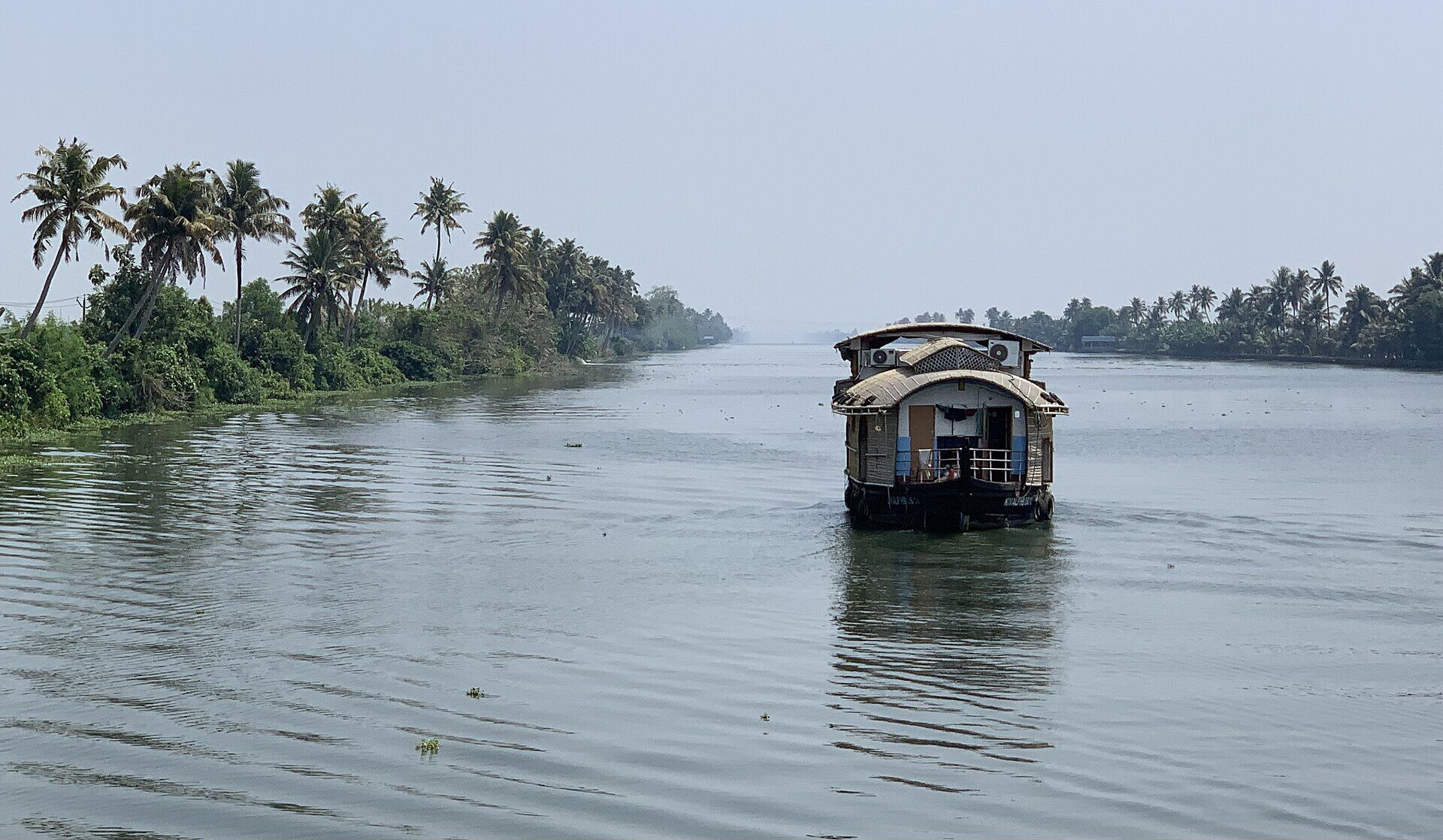 Kerala houseboat cruising the Alleppey backwaters at dawn
